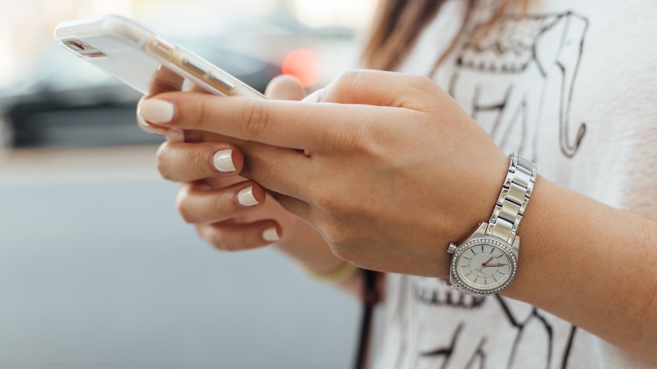 A person booking an appointment on their smartphone